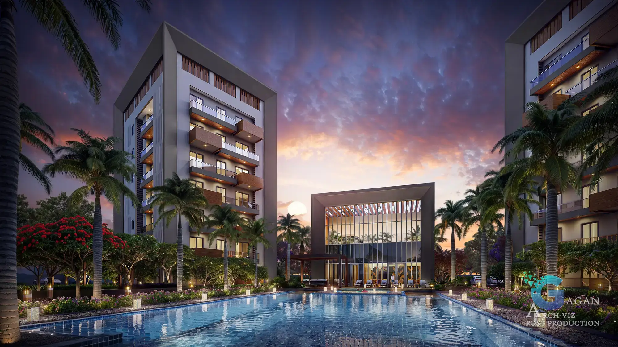 Photorealistic 3D rendering of a modern residential complex at sunset, featuring two tall buildings with multiple balconies surrounded by palm trees, landscaped greenery, and a large illuminated swimming pool. The pool reflects the vibrant hues of the sunset sky, with tones of orange, pink, and purple adding dramatic effect. The right side includes a contemporary clubhouse with large glass windows and warm lighting, complementing the scene's ambiance. Post-production edits emphasize realistic textures, precise color grading, and balanced reflections, creating a professional and polished architectural visualization